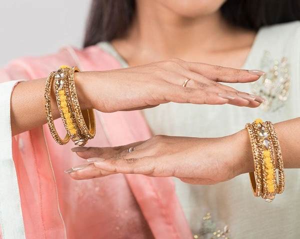 Metal with Zircon Gemstones Glossy Finished Gold & Yellow Color Bangles Set together in two hands
